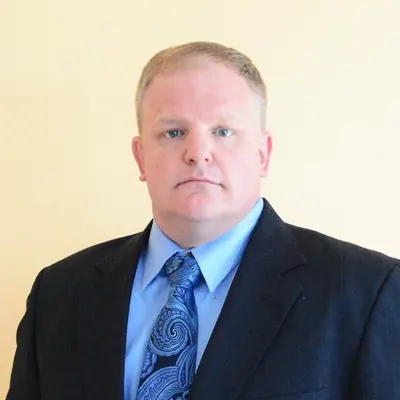 Portrait of Tim Clark, CEO of Aggressive Hiring Group